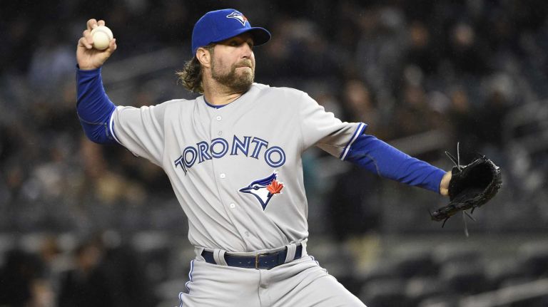Toronto Blue Jays starting pitcher R.A. Dickey delivers in the first inning against the New York Yankees in an MLB game at Yankee Stadium on Wednesday, April 8, 2015.