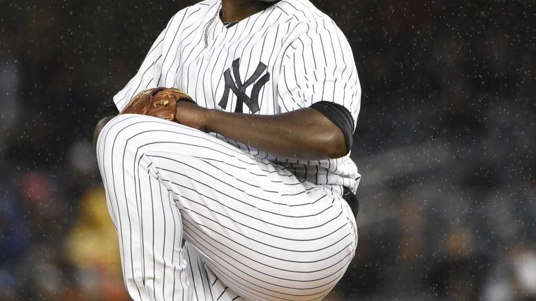 New York Yankees starting pitcher Michael Pineda delivers in the first inning against the Toronto Blue Jays in an MLB game at Yankee Stadium on Wednesday, April 8, 2015.