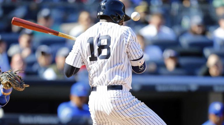 Didi Gregorius #18 of the New York Yankees is hit by a pitch in the eighth inning against the Toronto Blue Jays during Opening Day at Yankee Stadium on Monday, April 6, 2015.