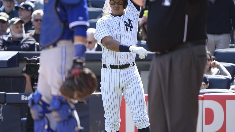 New York Yankees third baseman Alex Rodriguez stands on deck in the second inning against the Toronto Blue Jays on Opening Day at Yankee Stadium on Monday, April 6, 2015.