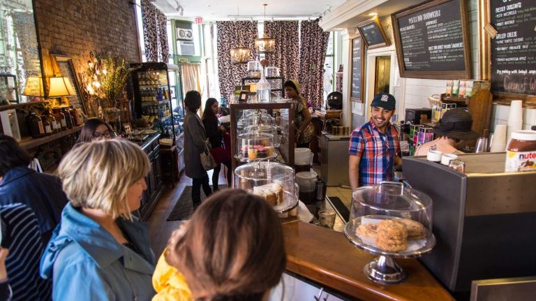 Customers in Urban Vintage in the Clinton Hill neighborhood of Brooklyn on April 6, 2015. Neighborhood Feature on Clinton HIll.