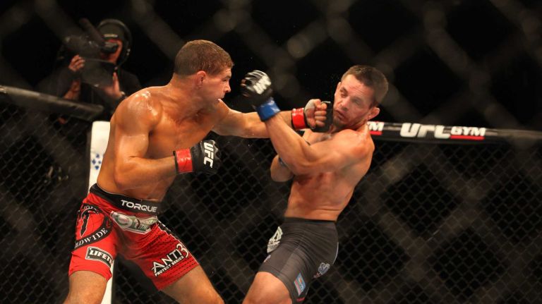 Television spoiled the MMA viewer at home. The TV viewer has no obstructed view through a fence or padding and doesn't have to look across the entire cage to determine damage. Instead, they get the best view possible through multiple camera angles. While the UFC provides monitors for judges to use cageside, that is not a requirement. Also, the UFC is the only MMA promotion to provide such technology for judges. 