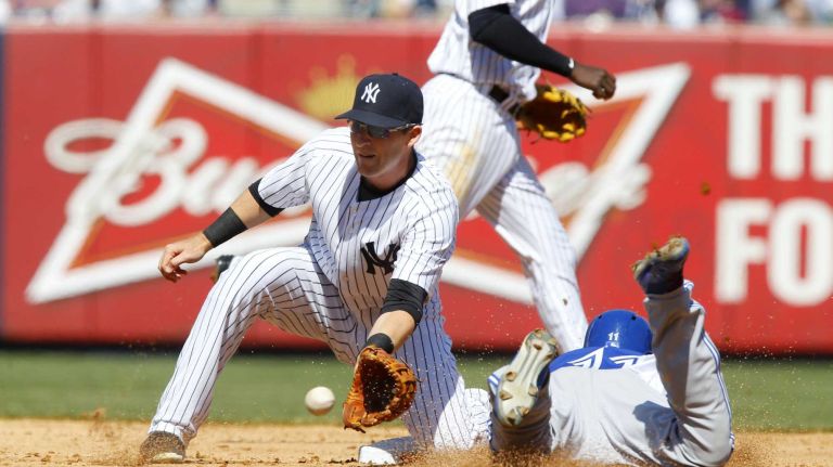 Yankees Opening Day in 2015 35 Kevin Pillar #11 of the Toronto Blue Jays steals second base in the fourth inning ahead of the throw to Stephen Drew #14 of the New York Yankees during Opening Day at Yankee Stadium on Monday, April 6, 2015.