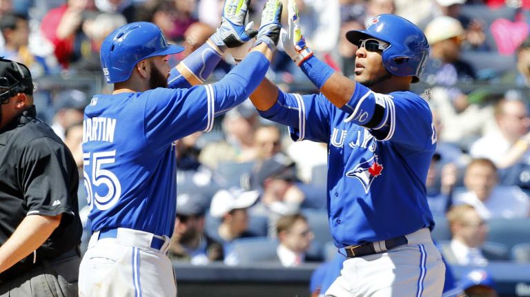 Yankees Opening Day in 2015 39 Edwin Encarnacion #10 of the Toronto Blue Jays celebrates his third-inning two-run home run against the New York Yankees with teammate Russell Martin #55 during Opening Day at Yankee Stadium on Monday, April 6, 2015.