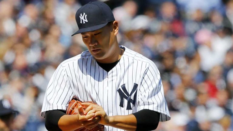 Yankees Opening Day in 2015 40 Masahiro Tanaka #19 of the New York Yankees looks on after giving up a third-inning two-run base hit against the Toronto Blue Jays during Opening Day at Yankee Stadium on Monday, April 6, 2015.