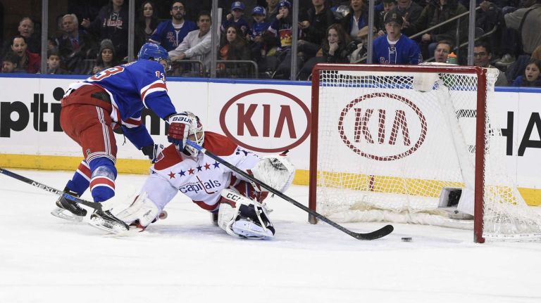 Rangers vs. Capitals 49 New York Rangers right wing Kevin Hayes scores on Washington Capitals goalie Braden Holtby in the first period of an NHL hockey game at Madison Square Garden on Sunday, March 29, 2015.