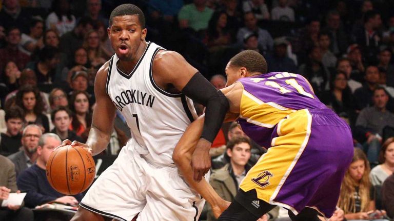 Brooklyn Nets small forward Joe Johnson #7 drives around Los Angeles Lakers small forward Wesley Johnson #11 during the second quarter of a game at Barclays Center on Sunday, March 29, 2015.