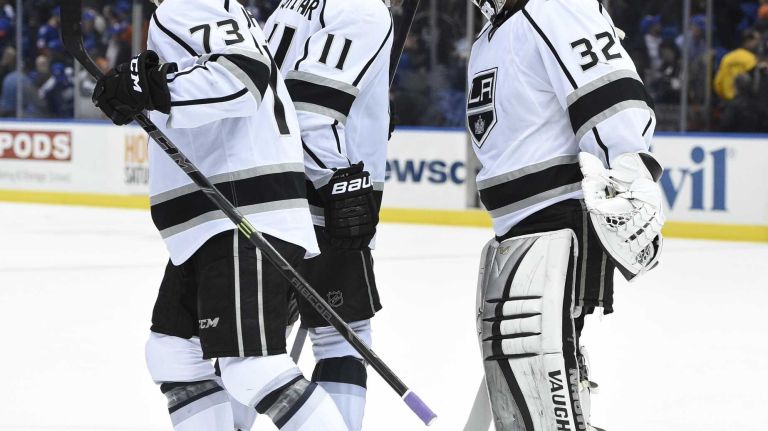 Los Angeles Kings center Anze Kopitar congratulates Los Angeles Kings goalie Jonathan Quick at the end of an NHL hockey game against the New York Islanders at Nassau Coliseum on Thursday, March 26, 2015. The Kings defeated the Islanders 3-2.