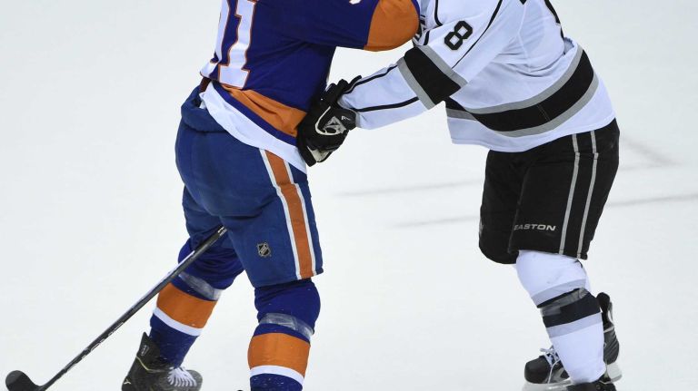 New York Islanders center John Tavares and Los Angeles Kings defenseman Drew Doughty collide in the second period of an NHL hockey game at Nassau Coliseum on Thursday, March 26, 2015.