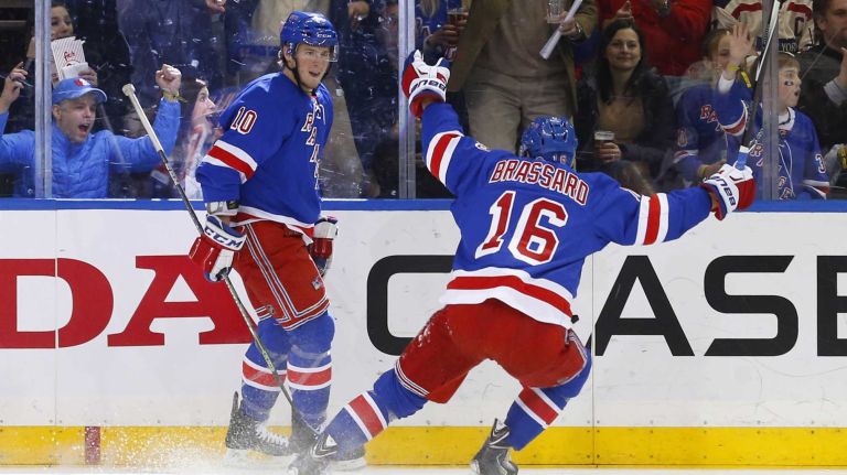 J.T. Miller #10 of the New York Rangers celebrates his second-period goal against the Anaheim Ducks with teammate Derick Brassard #16 at Madison Square Garden on Sunday, March 22, 2015.