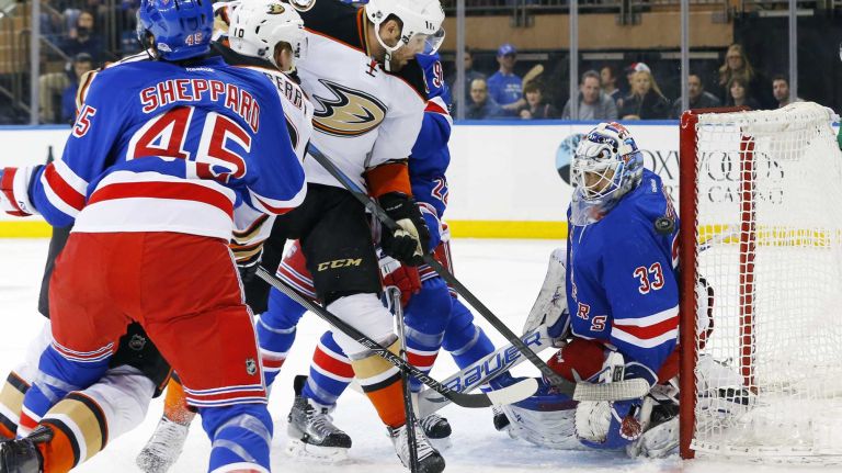 Cam Talbot #33 of the New York Rangers makes a save in the second period as teammate James Sheppard #45 defends against Patrick Maroon #19 of the Anaheim Ducks at Madison Square Garden on Sunday, March 22, 2015.