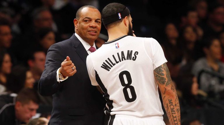 Lionel Hollins of the Brooklyn Nets talks with Deron Williams during a game against the Milwaukee Bucks at Barclays Center on Friday, March 20, 2015.
