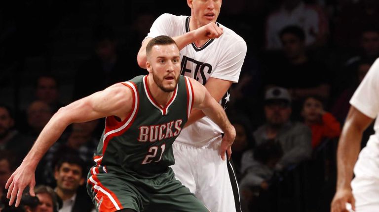 Mason Plumlee of the Brooklyn Nets defends against Miles Plumlee of the Milwaukee Bucks during the first half at Barclays Center on Friday, March 20, 2015.