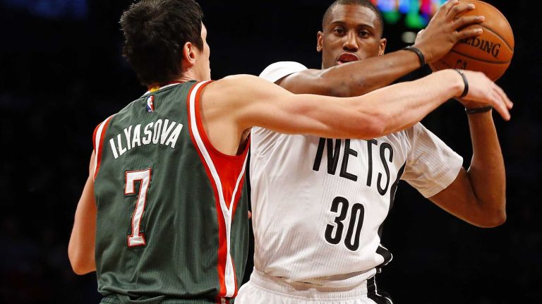 Thaddeus Young of the Brooklyn Nets controls the ball against Ersan Ilyasova of the Milwaukee Bucks in the first half at Barclays Center on Friday, March 20, 2015.