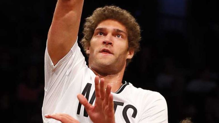 Brook Lopez of the Brooklyn Nets puts up a shot for a basket against Zaza Pachulia of the Milwaukee Bucks during the first half at Barclays Center on Friday, March 20, 2015.