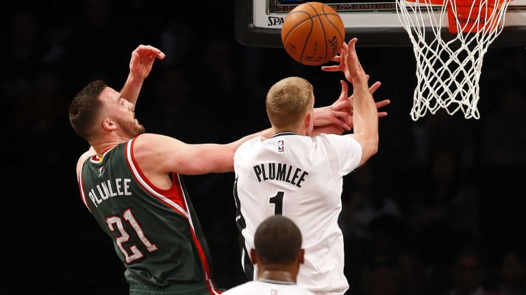 Mason Plumlee of the Brooklyn Nets battles for a rebound against Miles Plumlee of the Milwaukee Bucks during the first half at Barclays Center on Friday, March 20, 2015.
