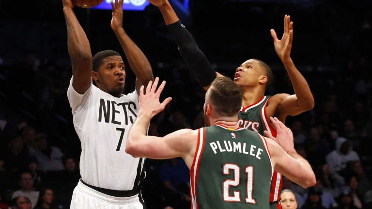 Joe Johnson of the Brooklyn Nets looks to pass the ball against Miles Plumlee of the Milwaukee Bucks at Barclays Center on Friday, March 20, 2015.