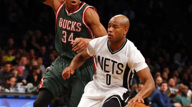 Jarrett Jack of the Brooklyn Nets controls the ball in the first half against Giannis Antetokounmpo of the Milwaukee Bucks at Barclays Center on Friday, March 20, 2015.