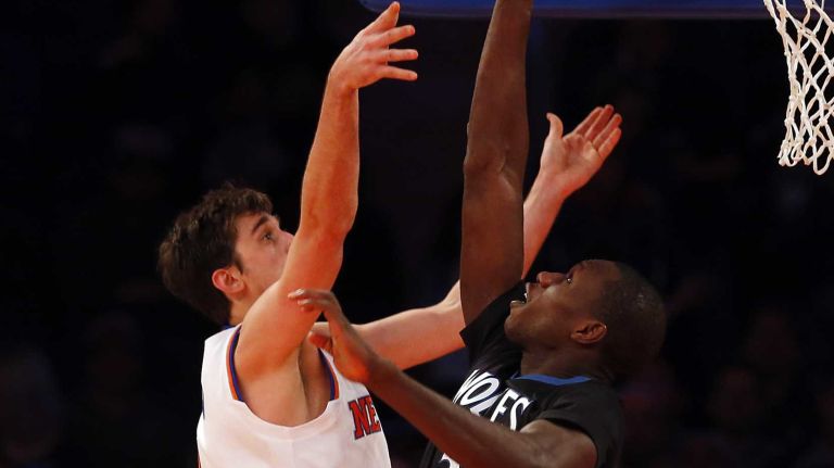 Gorgui Dieng of the Minnesota Timberwolves blocks a shot against Alexey Shved of the New York Knicks at Madison Square Garden on Thursday, March 19, 2015.