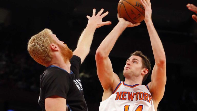 Jason Smith #14 of the New York Knicks puts up a shot against Chase Budinger #10 of the Minnesota Timberwolves during the first half at Madison Square Garden on Thursday, March 19, 2015.