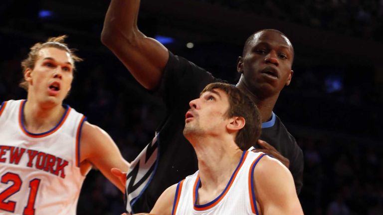 Alexey Shved #1 of the New York Knicks looks for room against Gorgui Dieng #5 of the Minnesota Timberwolves during the first half at Madison Square Garden on Thursday, March 19, 2015.