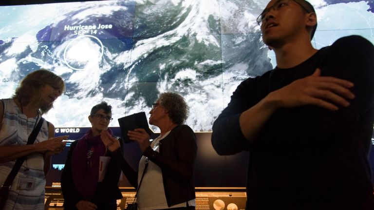 The effects of climate change can be seen up close at updated American Museum of Natural History exhibit 1 Brian Foo, right, a member of the exhibition team at the American Museum of Natural History, trains volunteers at the museum's newly updated climate change section in the David S. and Ruth L. Gottesman Hall of Planet Earth.