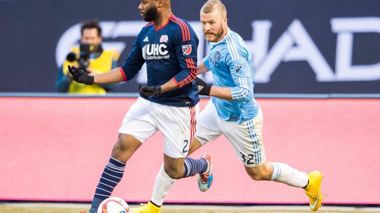 New England Revolution defender Andrew Farrell (2) is pursued by New York City FC forward Adam Nemec (32) during a game at Yankee Stadium on Sunday, March 15, 2015.