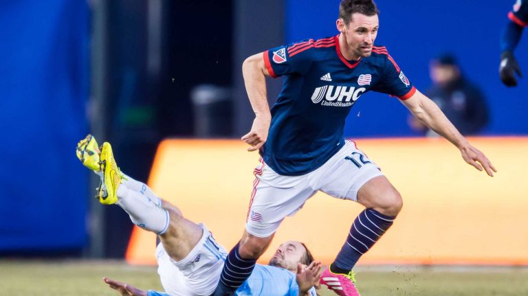 New York City FC midfielder Mix Diskerud (10) collides with New England Revolution midfielder Andy Dorman (12) before falling to the ground during a game at Yankee Stadium on Sunday, March 15, 2015.