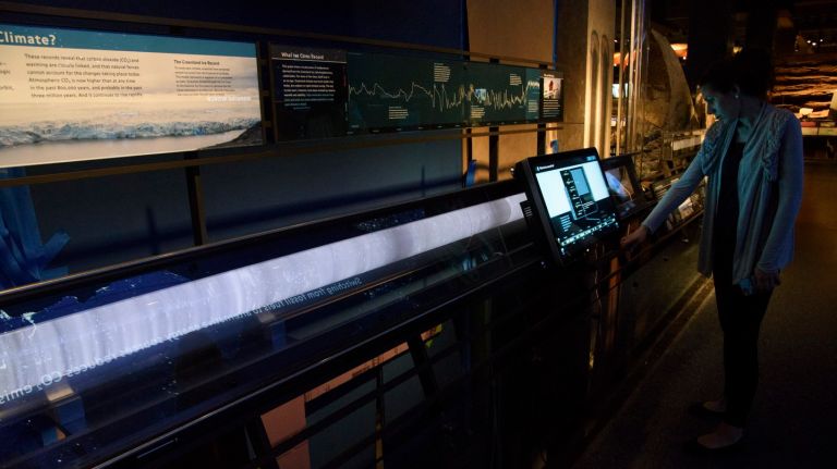 The effects of climate change can be seen up close at updated American Museum of Natural History exhibit 2 A staff member from the American Museum of Natural History demonstrates an interactive display and reproduction of an ice core sample from Greenland in the newly updated climate change section.