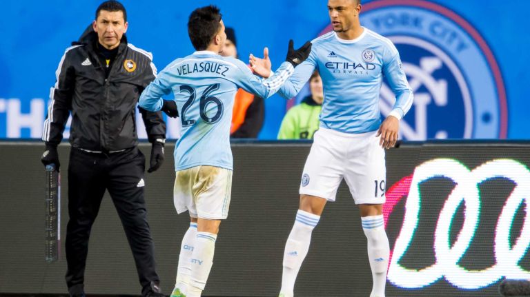 New York City FC midfielder Sebastian Velasquez (26) is subbed out for teammate forward Khiry Shelton (19) against the New England Revolution during a game at Yankee Stadium on Sunday, March 15, 2015.