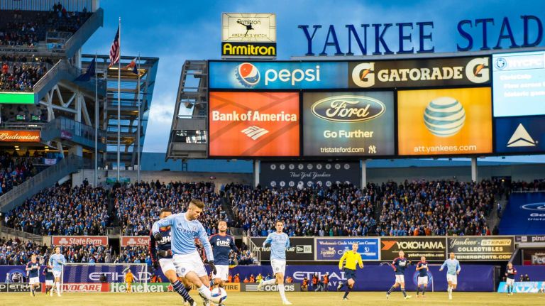 New York City FC defender Chris Wingert (17) gains control of the ball against the New England Revolution during a game at Yankee Stadium on Sunday, March 15, 2015.