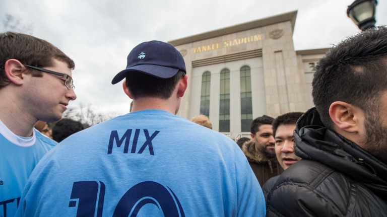 A New York City FC fan wearing midfielder Mix Diskerud's No. 10 jersey waits to enter the stadium before a game between the New York City FC and the New England Revolution at Yankee Stadium on Sunday, March 15, 2015.