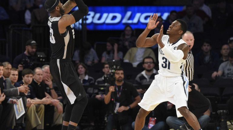 Providence Friars forward LaDontae Henton shoots a three-point basket past Villanova Wildcats guard Dylan Ennis in a Big East semifinal men's basketball game at Madison Square Garden on Friday, March 13, 2015.