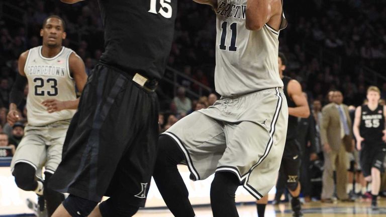 Big East Tournament semifinal: Georgetown vs. Xavier 33 Georgetown Hoyas forward Isaac Copeland is fouled by Xavier Musketeers guard Myles Davis in a Big East semifinal men's basketball game at Madison Square Garden on Friday, March 13, 2015.