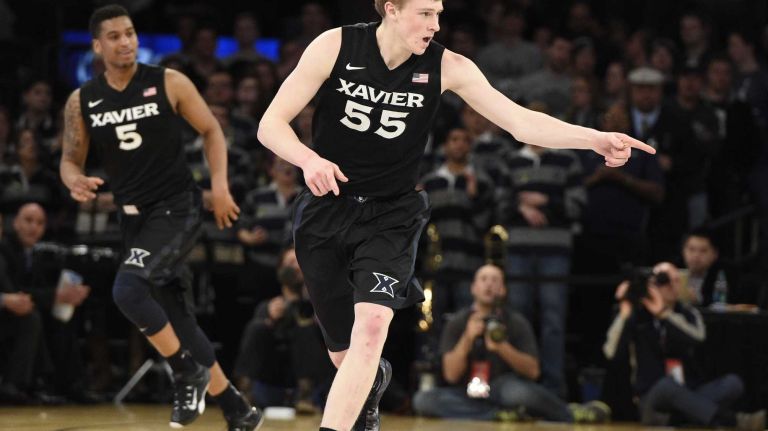 Big East Tournament semifinal: Georgetown vs. Xavier 36 Xavier Musketeers guard J.P. Macura reacts after he sinks a three-point basket against the Georgetown Hoyas in a Big East semifinal men's basketball game at Madison Square Garden on Friday, March 13, 2015.