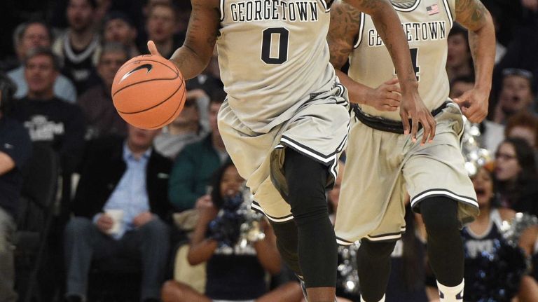 Big East Tournament semifinal: Georgetown vs. Xavier 39 Georgetown Hoyas center L.J. Peak controls the ball against the Xavier Musketeers in a Big East semifinal men's basketball game at Madison Square Garden on Friday, March 13, 2015.