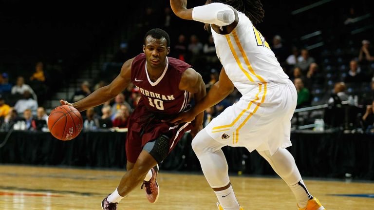 NEW YORK, NY - MARCH 12: Jon Severe #10 of the Fordham Rams drives against Mo Alie-Cox #12 of the Virginia Commonwealth Rams during the Second Round of the Atlantic 10 Basketball Tournament at Barclays Center on March 12, 2015 in New York, New York. (Photo by Mike Stobe/Getty Images)