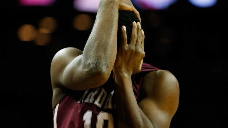 NEW YORK, NY - MARCH 12: Jon Severe #10 of the Fordham Rams reacts after being hit in the eye against the Virginia Commonwealth Rams during the Second Round of the Atlantic 10 Basketball Tournament at Barclays Center on March 12, 2015 in New York, New York. Virginia Commonwealth Rams defeated the Fordham Rams 63-57. (Photo by Mike Stobe/Getty Images)
