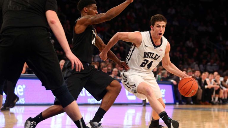 Butler Bulldogs guard Kellen Dunham controls the ball against Xavier Musketeers guard Remy Abell during the first half of a Big East Tournament game at Madison Square Garden on Thursday, March 12, 2015.
