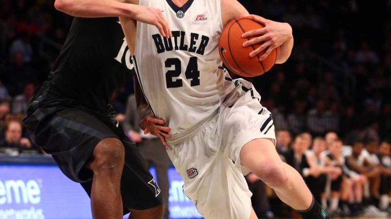 Butler Bulldogs guard Kellen Dunham drives against Xavier Musketeers guard Remy Abell during the first half of a Big East Tournament game at Madison Square Garden on Thursday, March 12, 2015.