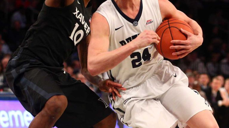 Butler Bulldogs guard Kellen Dunham controls the ball against Xavier Musketeers guard Remy Abell during the first half of a Big East Tournament game at Madison Square Garden on Thursday, March 12, 2015.