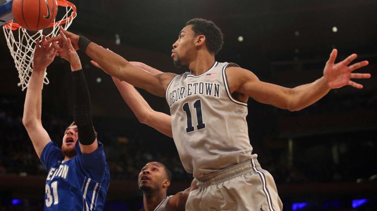 Creighton Bluejays center Will Artino fights for a layup with Georgetown Hoyas forward Isaac Copeland during the first half of a Big East Tournament game at Madison Square Garden on Thursday, March 12, 2015.