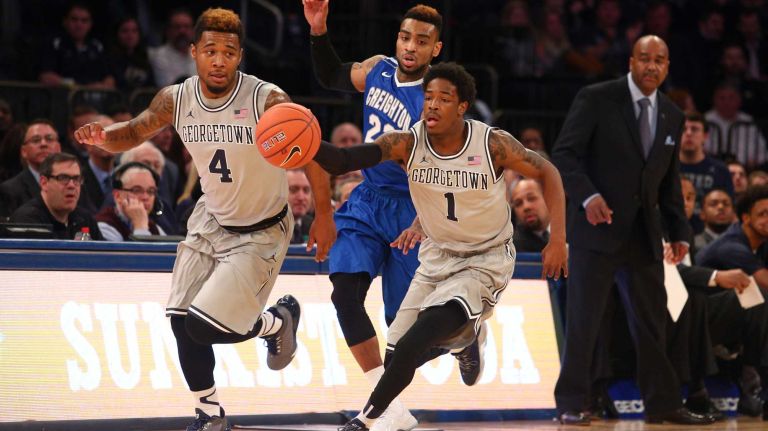 Georgetown Hoyas guard Tre Campbell leads a fast break against Creighton Bluejays guard James Milliken in front of Georgetown Hoyas guard D'Vauntes Smith-Rivera during the first half of a Big East Tournament game at Madison Square Garden on Thursday, March 12, 2015.