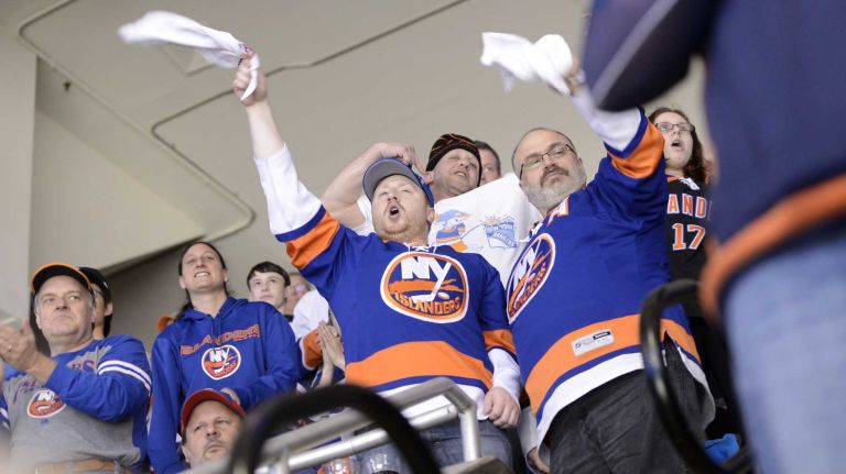 Fans at Islanders vs. Rangers 25 Islanders fans cheer a goal at Nassau Coliseum during the last Islanders-Rangers regular-season game at the Coliseum on March 10, 2015.