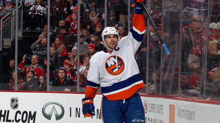 John Tavares of the New York Islanders scores at 13:47 of the second period against the New Jersey Devils to tie the score at 2-2 at the Prudential Center on Jan. 9, 2015 in Newark, N.J.