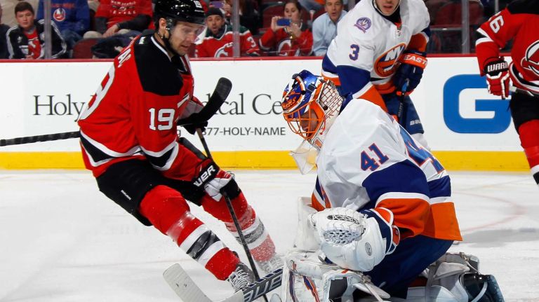 Jaroslav Halak of the New York Islanders makes the second period stop on Travis Zajac of the New Jersey Devils at the Prudential Center on Jan. 9, 2015 in Newark, N.J.