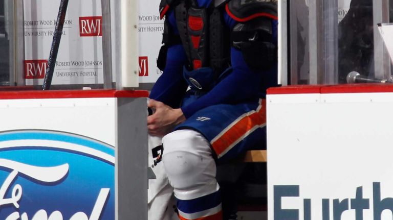 Matt Martin of the New York Islanders sits in the penalty box following his second-period fight with Mark Fraser of the New Jersey Devils at the Prudential Center on Jan. 9, 2015 in Newark, N.J.