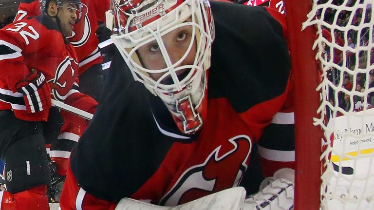 Keith Kinkaid of the New Jersey Devils looks back into the net during the second period against the New York Islanders at the Prudential Center on Jan. 9, 2015 in Newark, N.J.