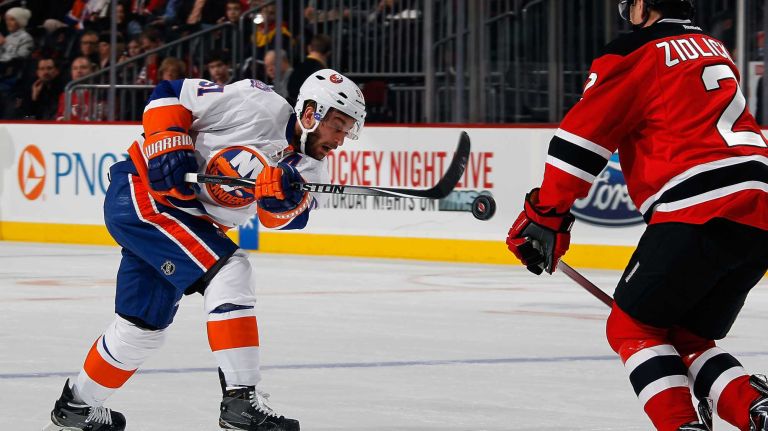 Marek Zidlicky of the New Jersey Devils looks to block a shot by Frans Nielsen of the New York Islanders during the first period at the Prudential Center on Jan. 9, 2015 in Newark, N.J.