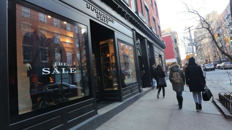 Stores along Bleecker Street near Perry Street.